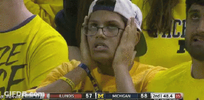 Person In Glasses And Cap Watching Michigan Vs Illinois GIF