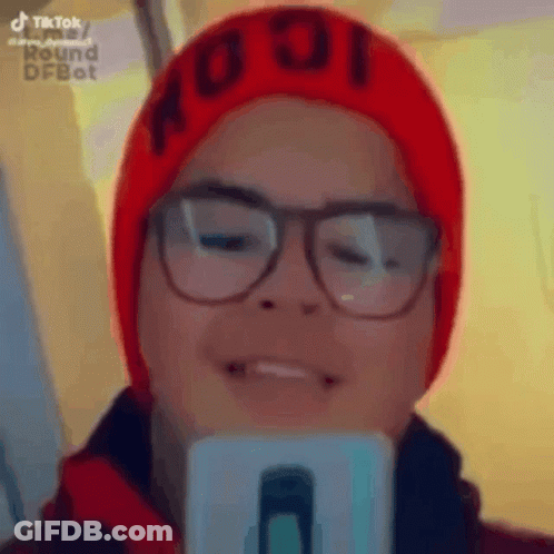 Person In Glasses And Red Hat Taking Selfie GIF