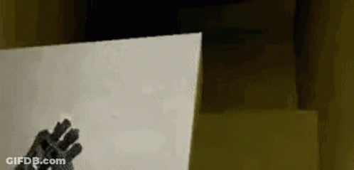 Person In Gloves Holding Paper GIF