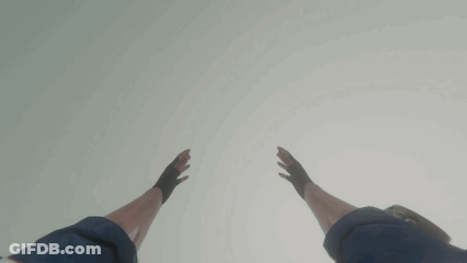 Person In Gloves Reaching Up GIF