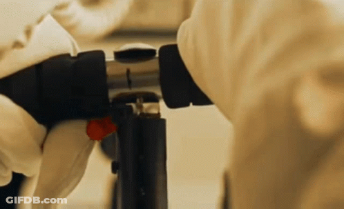 Person In Gloves Working On Equipment GIF