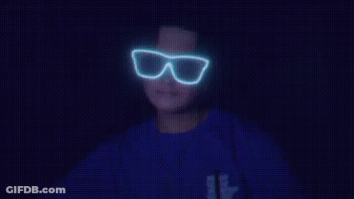 Person In Glow In The Dark Glasses And Blue Shirt With Letter B GIF