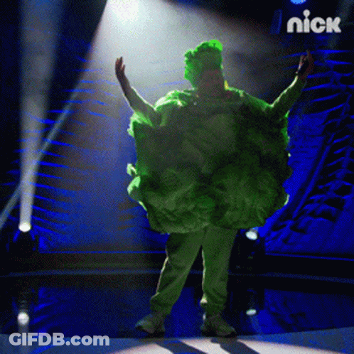 Person In Green Cabbage Costume On Stage With Nick Logo GIF