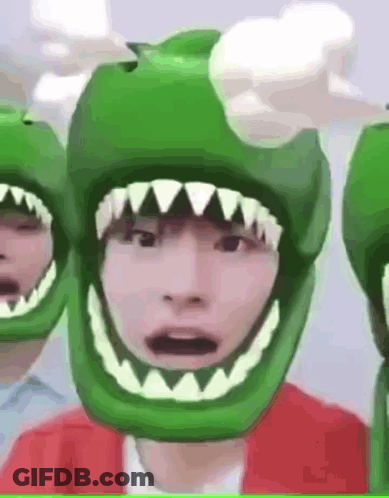 Person In Green Helmet With Sharp Teeth GIF