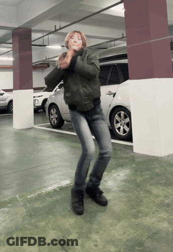 Person In Green Jacket Dancing GIF