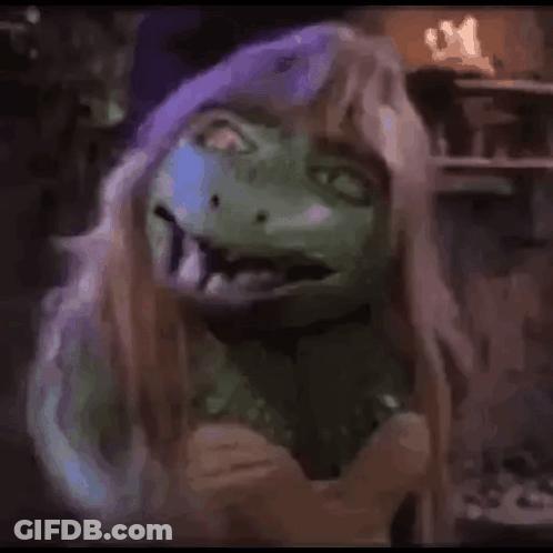 Person In Green Mask And Wig GIF