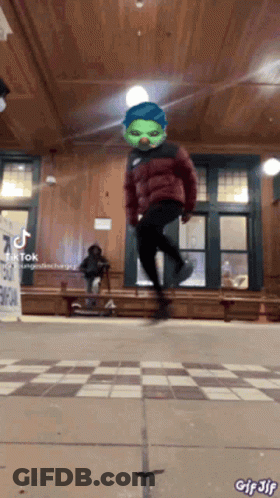 Person In Green Mask Jumping GIF