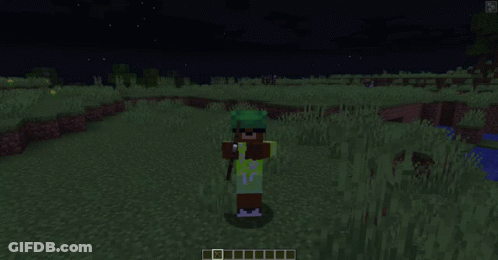 Person In Green Shirt Standing In Grass Field GIF