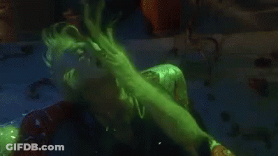 Person In Green Suit Eating Because Bored GIF