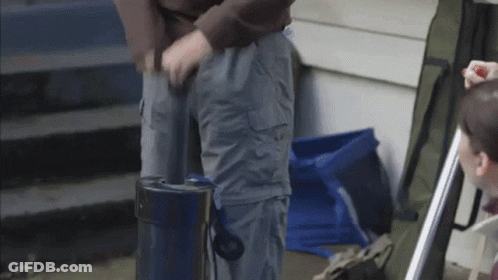 Person In Grey Cargo Pants With Blue Bag GIF