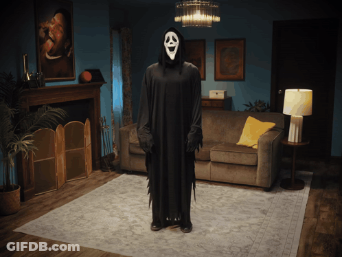 Person In Grim Reaper Costume In Living Room GIF