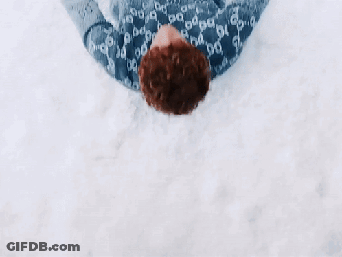 Person In Gucci Sweater Lying In Snow GIF