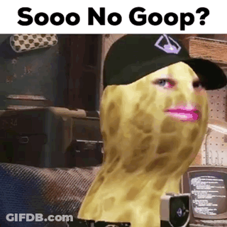 Person In Hat With Peanut On Face Holding Camera GIF