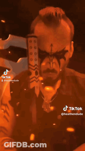 Person In Helmet Holding Axe With TikTok GIF