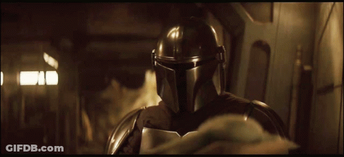 Person In Helmet Standing In Dark Room GIF