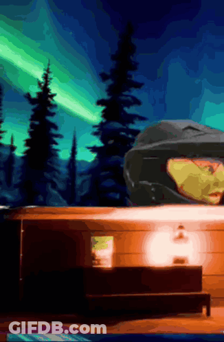 Person In Helmet Under Northern Lights GIF