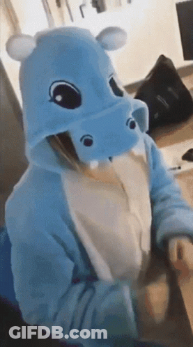 Person In Hippo Costume Sitting At Desk GIF