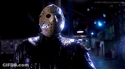 Person In Hockey Mask Holding Sword In Dark GIF