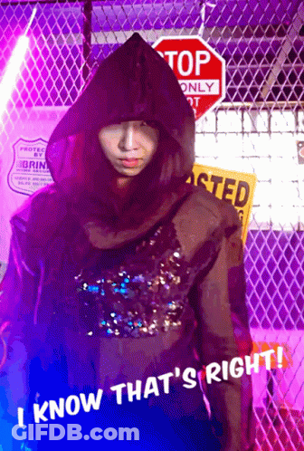 Person In Hooded Jacket At Stop Sign GIF