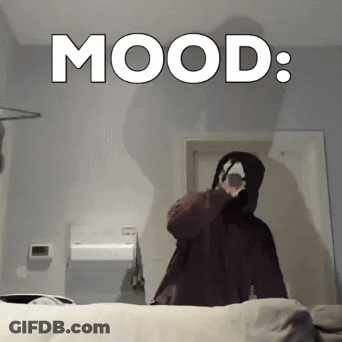 Person In Hooded Jacket In Front Of Mood Wall GIF