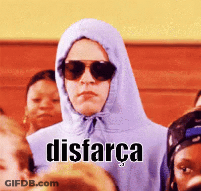 Person In Hoodie And Sunglasses Says Disfarca In Crowd GIF