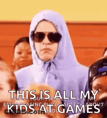 Person In Hoodie And Sunglasses Standing Before Kids GIF