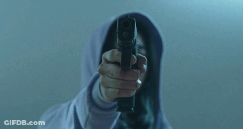 Person In Hoodie Holding Gun To Face GIF