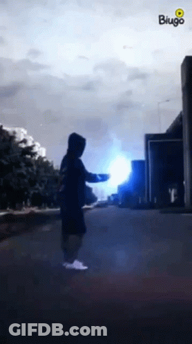 Person In Hoodie With Blue Light GIF