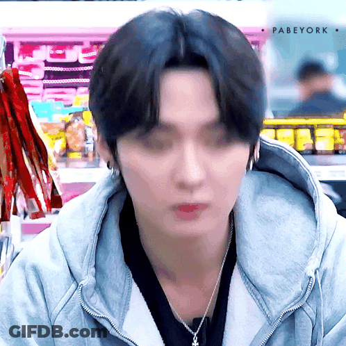 Person In Hoodie With Necklace GIF