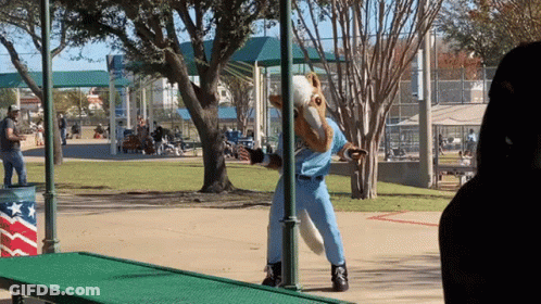 Person In Horse Costume Standing On Green Ramp GIF