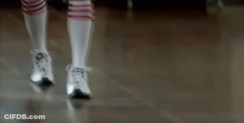Person In Knee High Socks And Sneakers Walking GIF