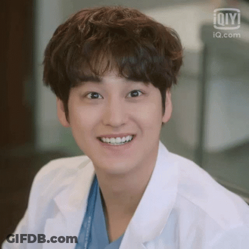 Person In Lab Coat Smiling GIF