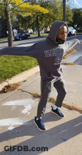 Person In Mackinac Sweatshirt On Sidewalk GIF