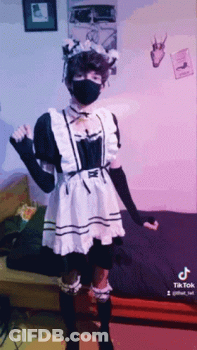 Person In Maid Costume And Black Mask GIF