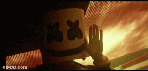 Person In Marshmallow Hat Waving By Fire GIF