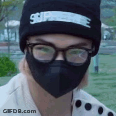 Person In Mask And Glasses With Black Beanie GIF