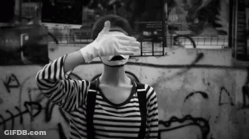 Person In Mime Mask Covering Eyes GIF