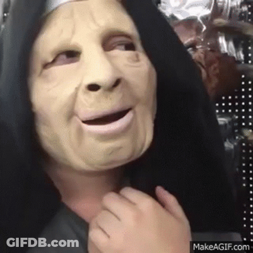 Person In Nun Mask And Black Hood Making Funny Face GIF