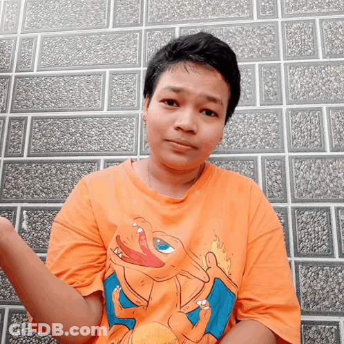 Person In Orange Shirt With Cartoon Character GIF