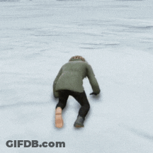 Person In Parka Walking On Snow GIF