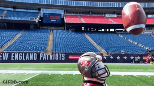 Person In Patriots Helmet Throwing Football GIF