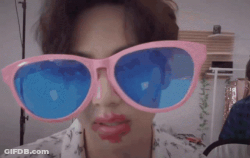 Person In Pink And Blue Sunglasses With Red Lipstick GIF