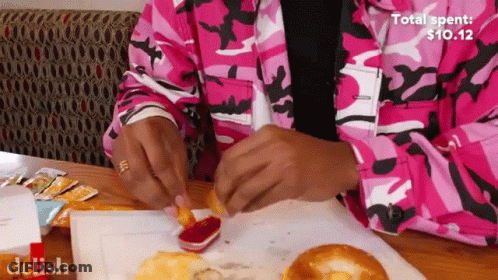 Person In Pink Camo Jacket Dipping Fries In Ketchup GIF