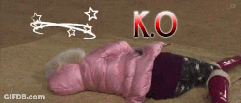 Person In Pink Jacket Laying On Floor With K.O GIF