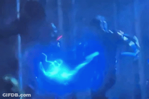 Person In Pink Mask Holding Sword In Dark GIF