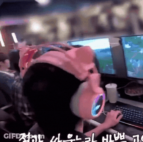 Person In Pink Pig Hat Playing Video Game GIF