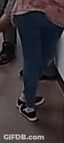 Person In Pink Shirt Walking On Subway GIF