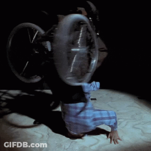 Person In Plaid Shirt Holding Wheel GIF