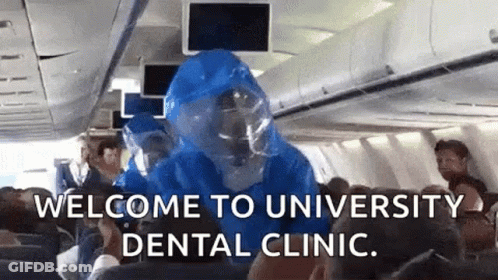 Person In Protective Suit On Plane GIF