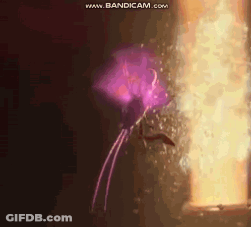 Person In Purple Cape Standing In Front Of Door With Purple Light GIF